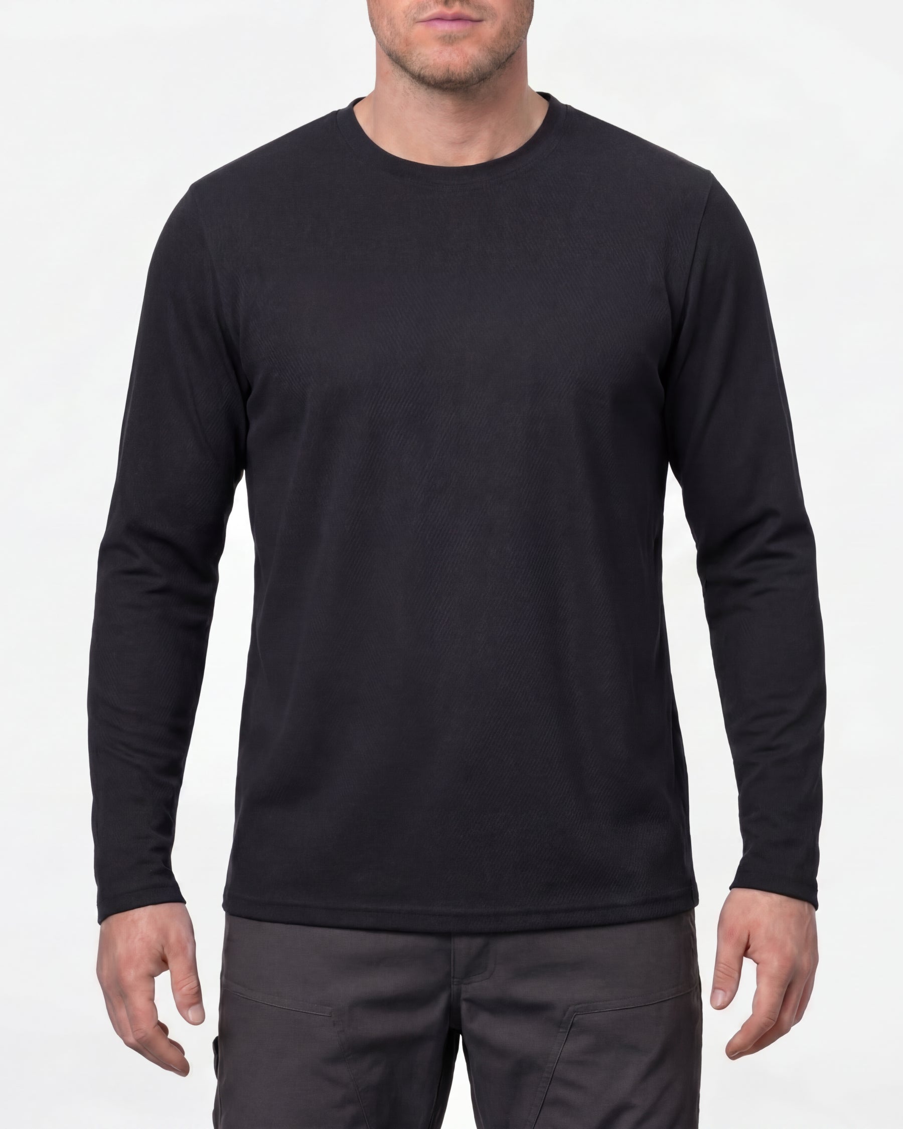 A model wears the STRAUSS Performance Long Sleeve Shirt in black in a studio product scene