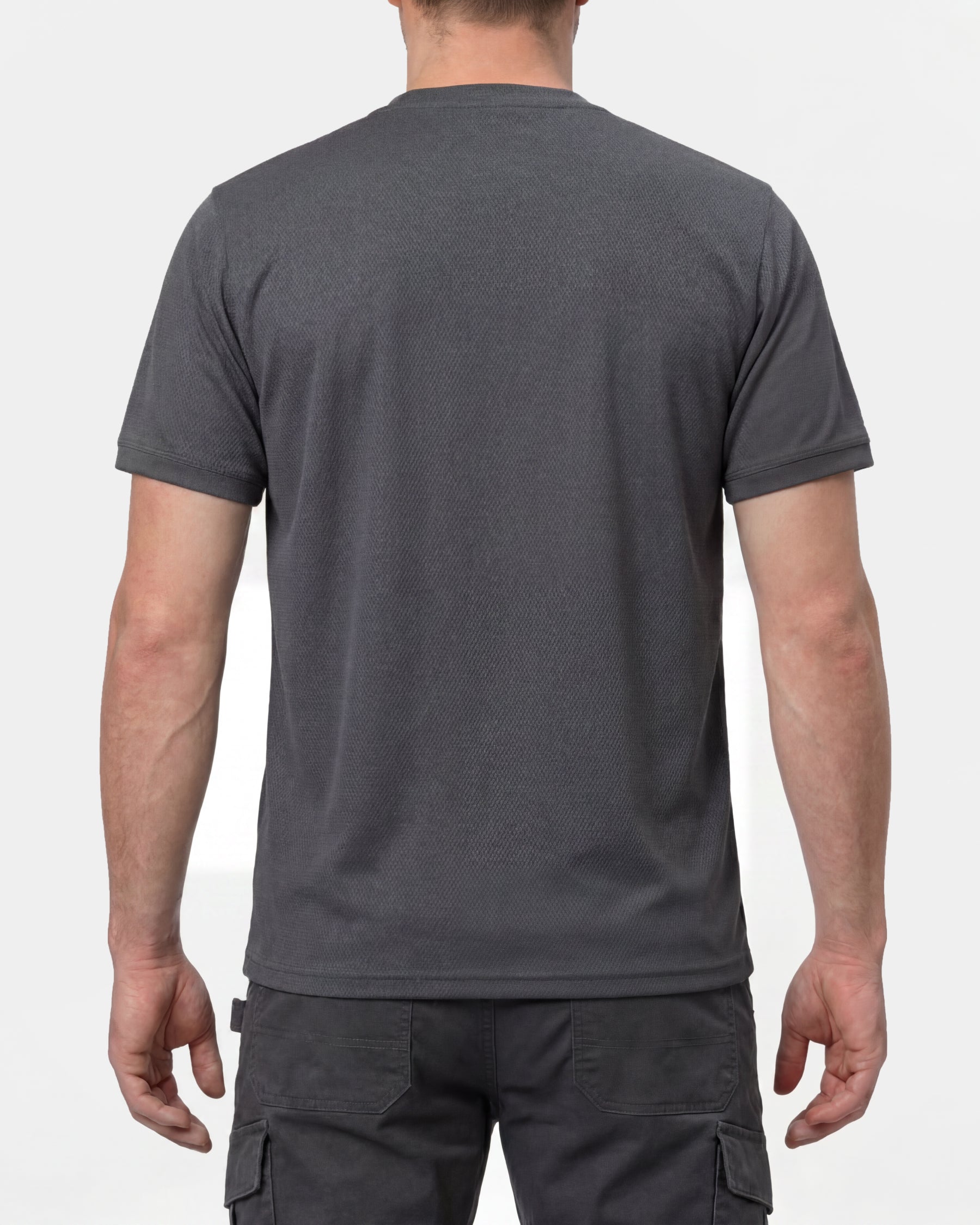 A model wears the STRAUSS Performance T-Shirt in carbon gray, showing the shirt fit