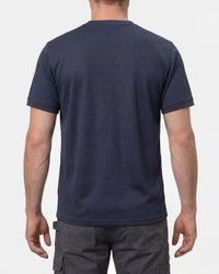A model wears the STRAUSS Performance T-Shirt in nero blue, showing the shirt fit