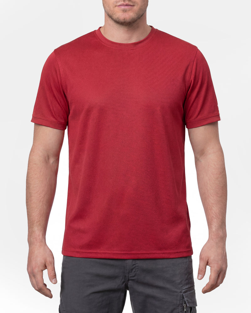 A model wears the STRAUSS Performance T-Shirt in fire red in a studio product scene
