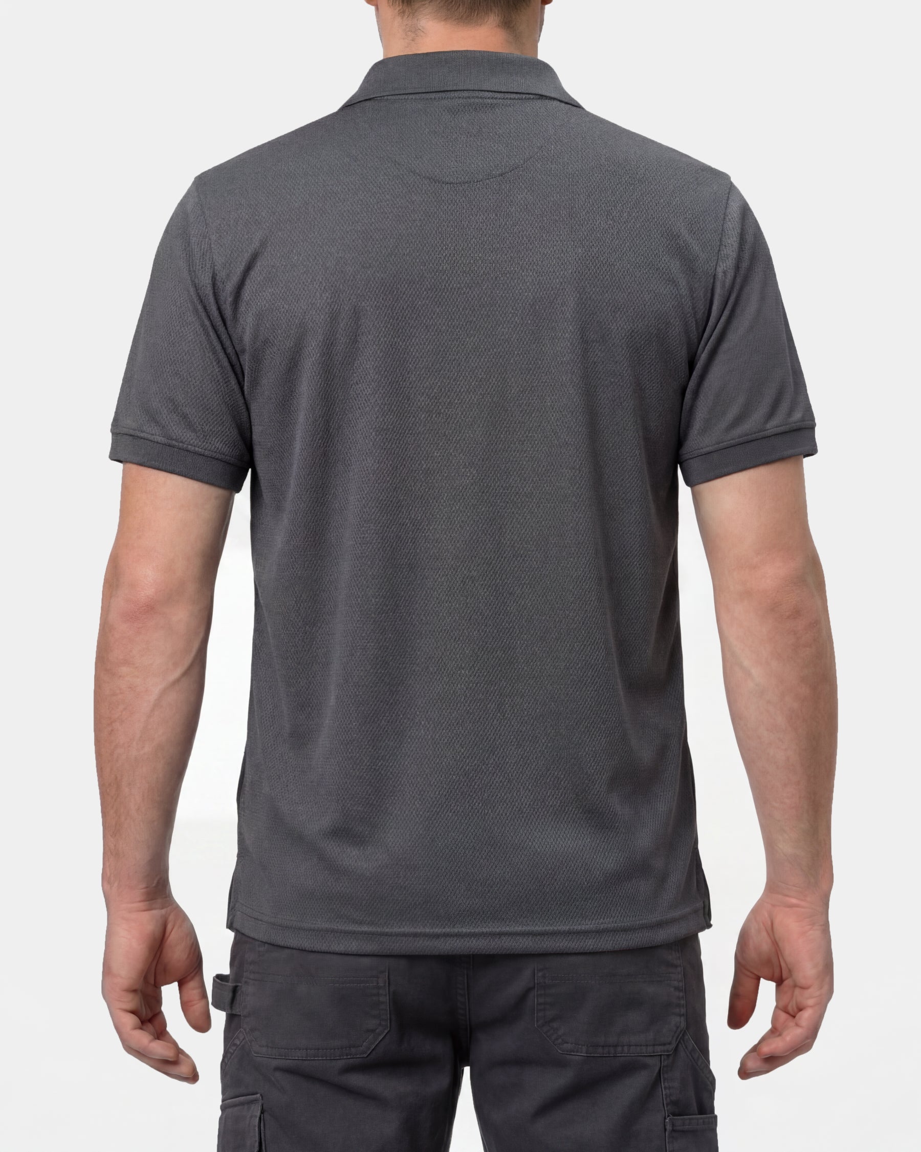 A model wears the STRAUSS Performance Polo Shirt in carbon gray, showing the shirt fit