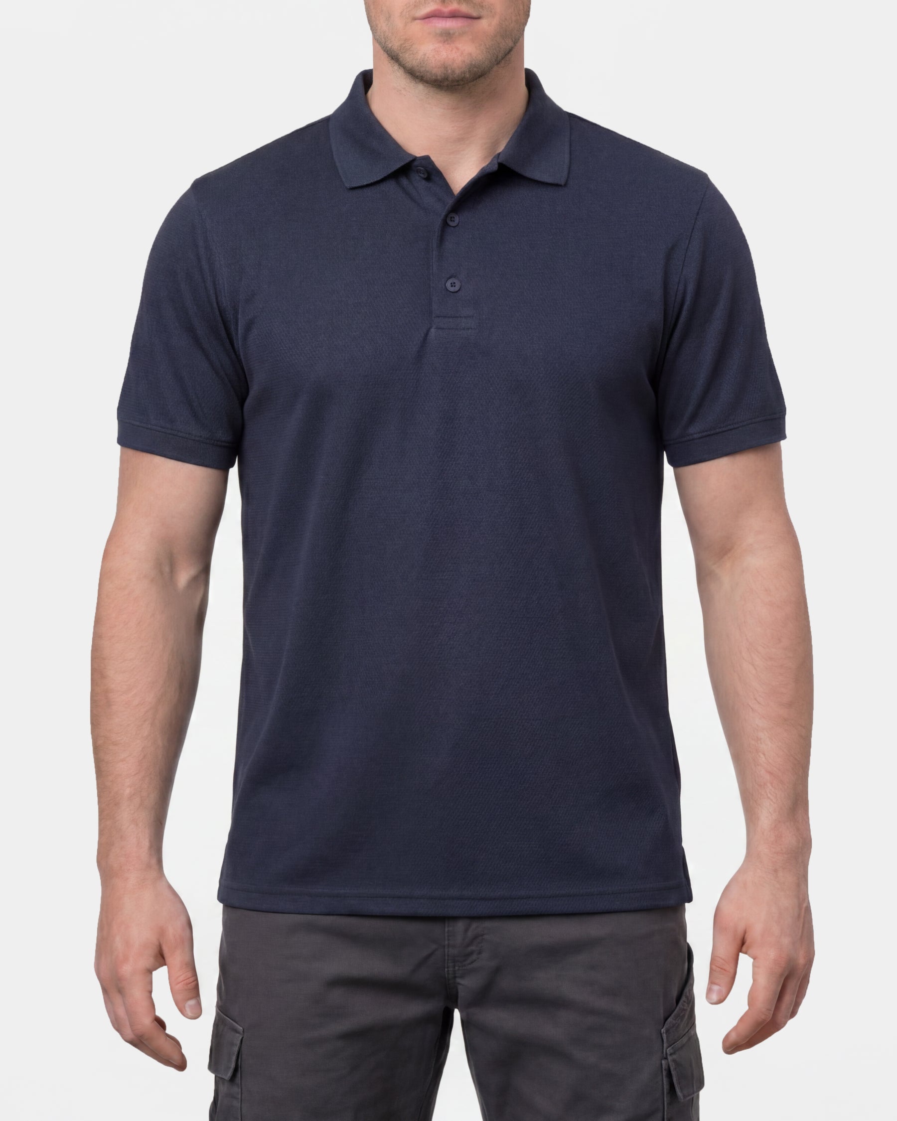 A model wears the STRAUSS Performance Polo Shirt in nero blue in a studio product scene