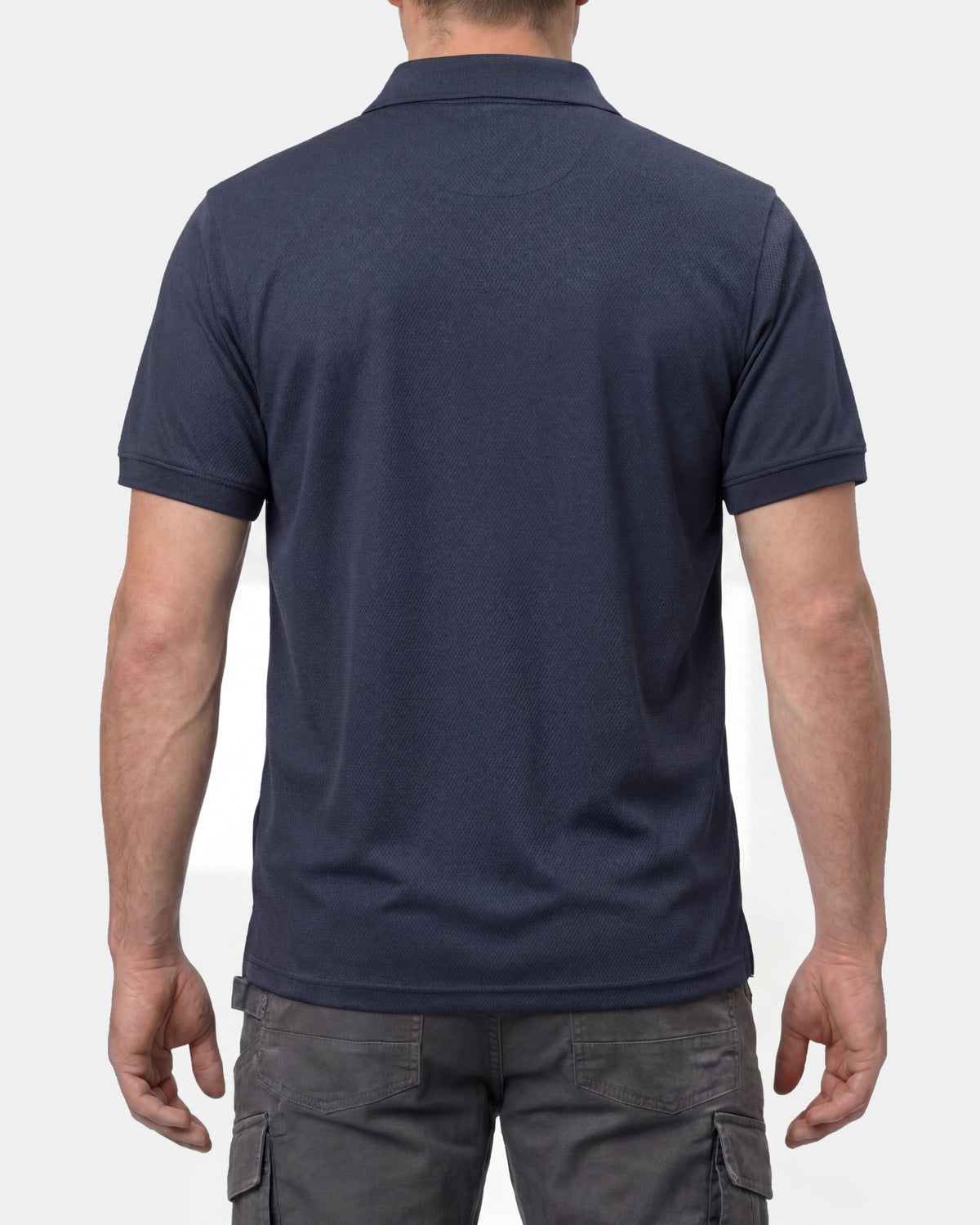 A model wears the STRAUSS Performance Polo Shirt in nero blue, showing the shirt fit