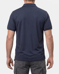 A model wears the STRAUSS Performance Polo Shirt in nero blue, showing the shirt fit