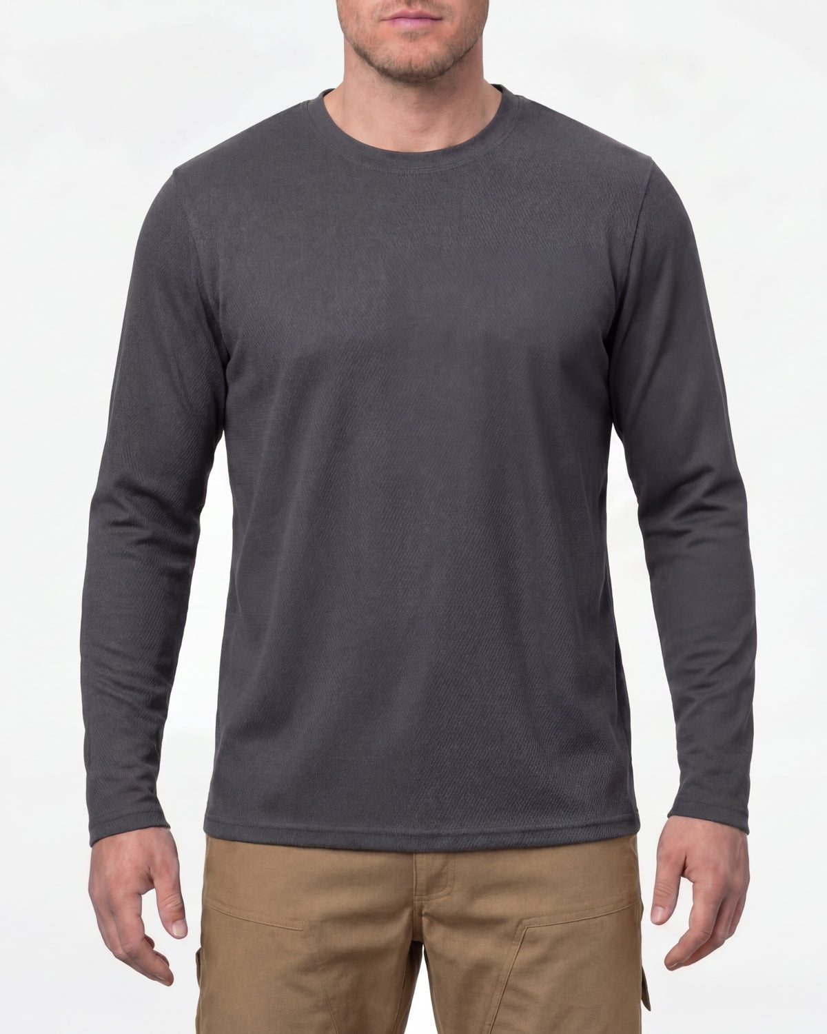 A model wears the STRAUSS Performance Long Sleeve Shirt in carbon gray with tan work pants and work boots in a studio product scene