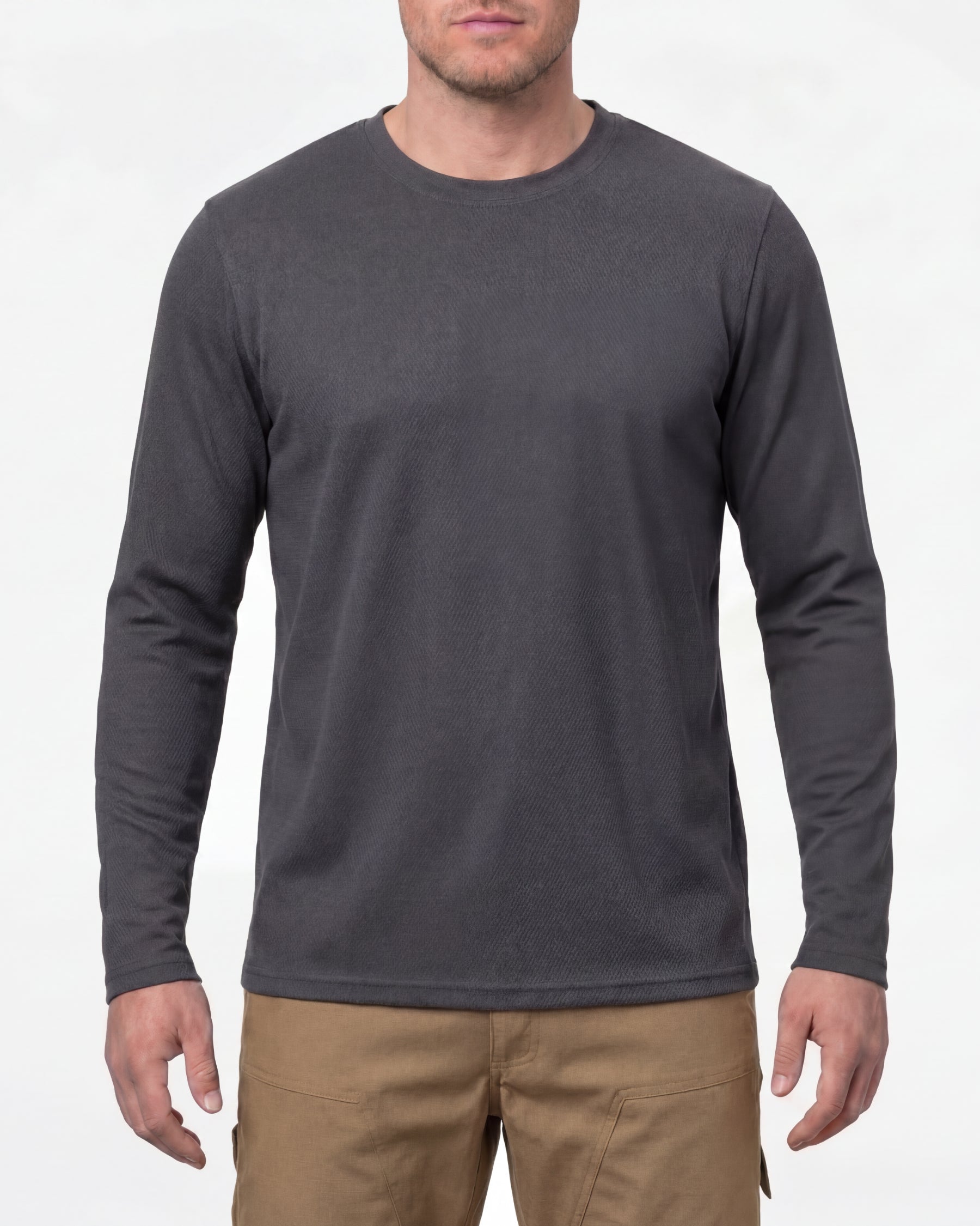 A model wears the STRAUSS Performance Long Sleeve Shirt in carbon gray with tan work pants and work boots in a studio product scene