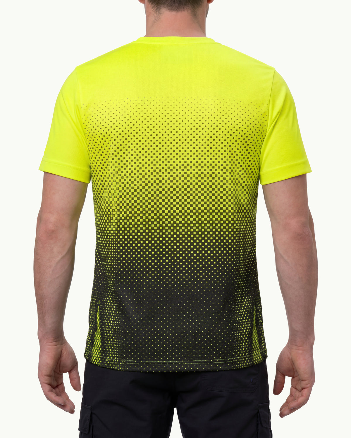 A model wears the STRAUSS Enhanced Visibility Performance T-Shirt e.s.t:aktik in neon yellow and black with black work pants in a high-visibility workwear outfit, showing the shirt fit