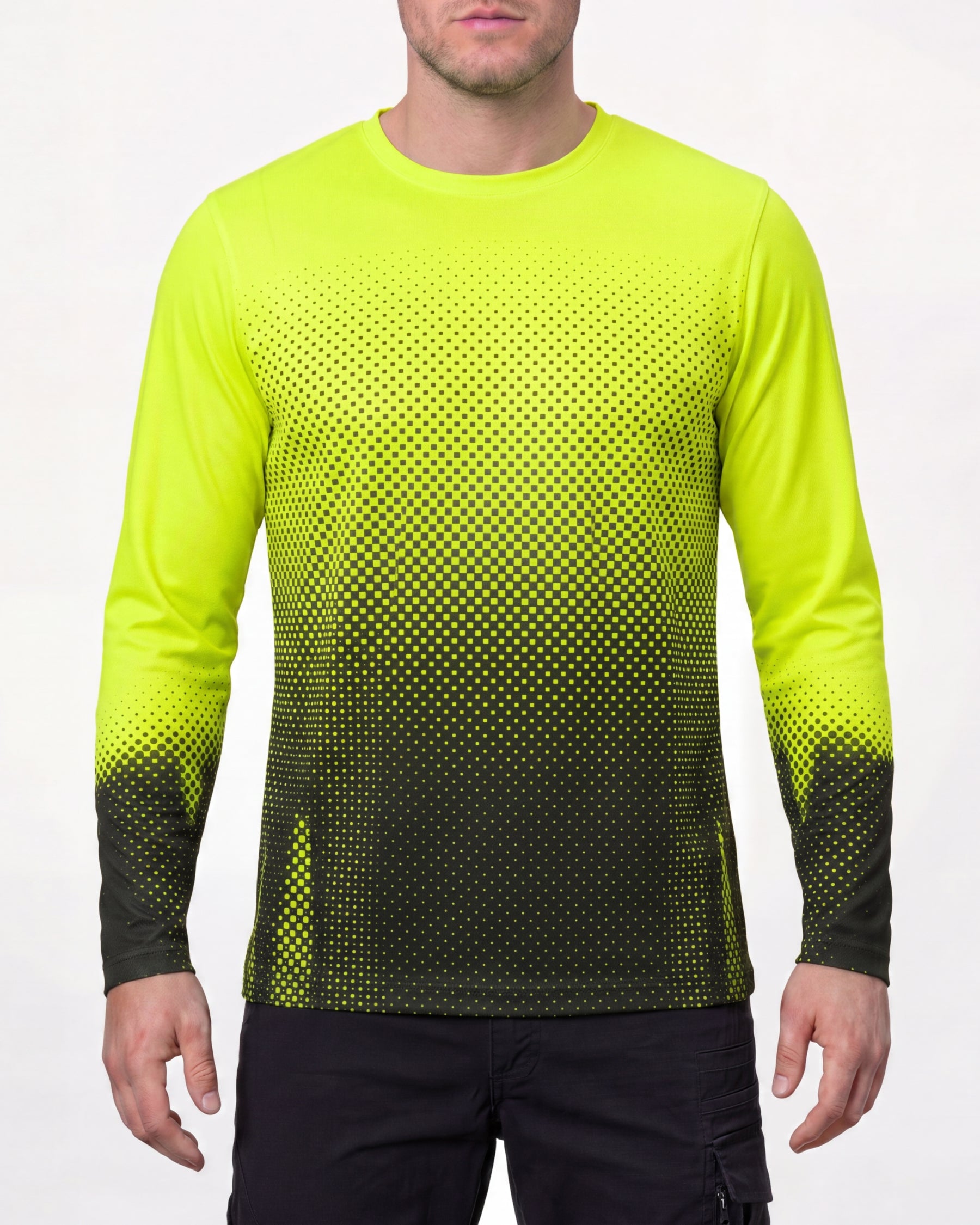 A model wears the STRAUSS Enhanced Visibility Performance Long Sleeve Shirt e.s.t:aktik in neon yellow and black with black work pants in a high-visibility workwear outfit in a studio product scene