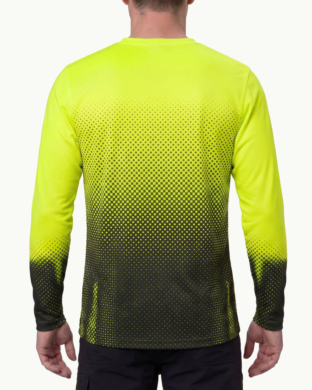 A model wears the STRAUSS Enhanced Visibility Performance Long Sleeve Shirt e.s.t:aktik in neon yellow and black with black work pants in a high-visibility workwear outfit, showing the shirt fit