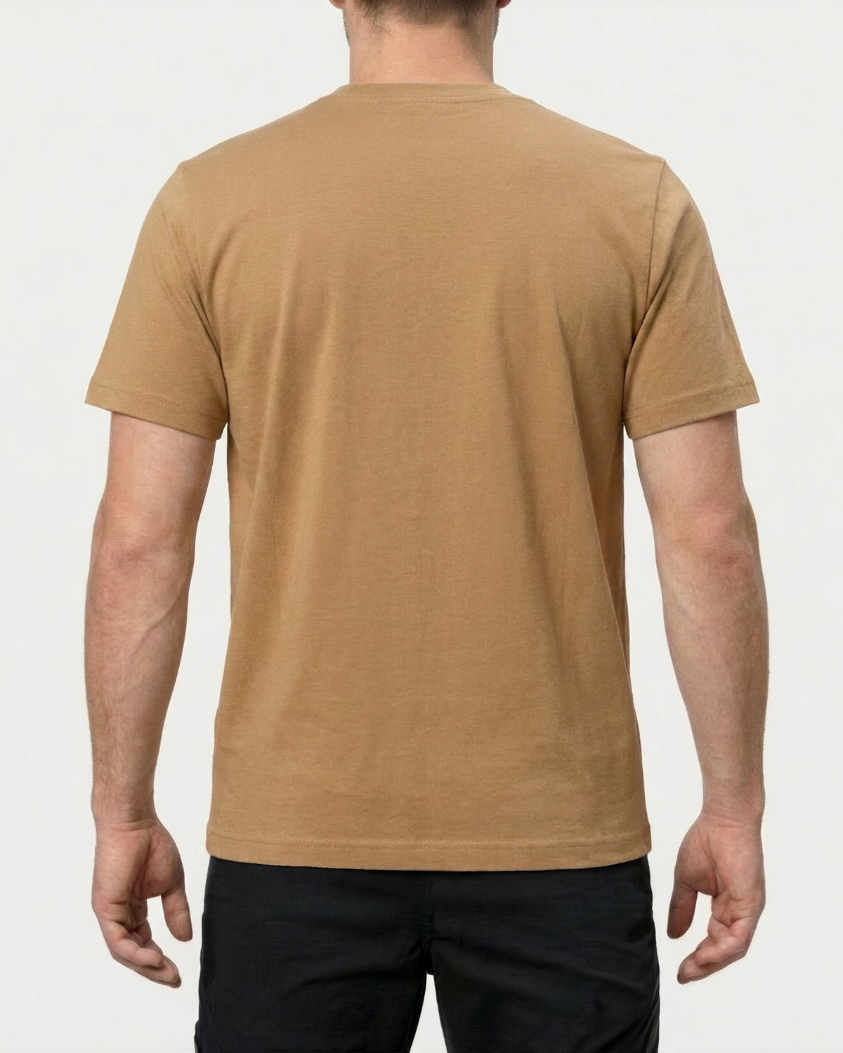 A model wears the STRAUSS Pocket T-Shirt e.s.iconic in almond brown with work pants and work boots, showing the shirt fit