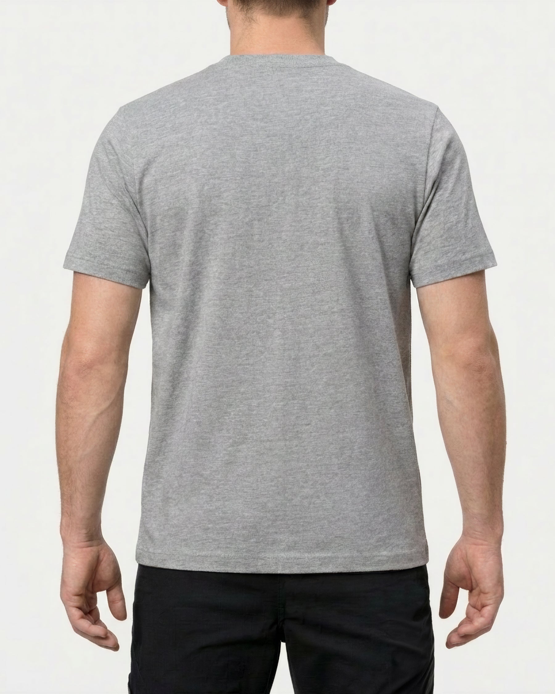 A model wears the STRAUSS Pocket T-Shirt e.s.iconic in gray melange with work pants and work boots, showing the shirt fit