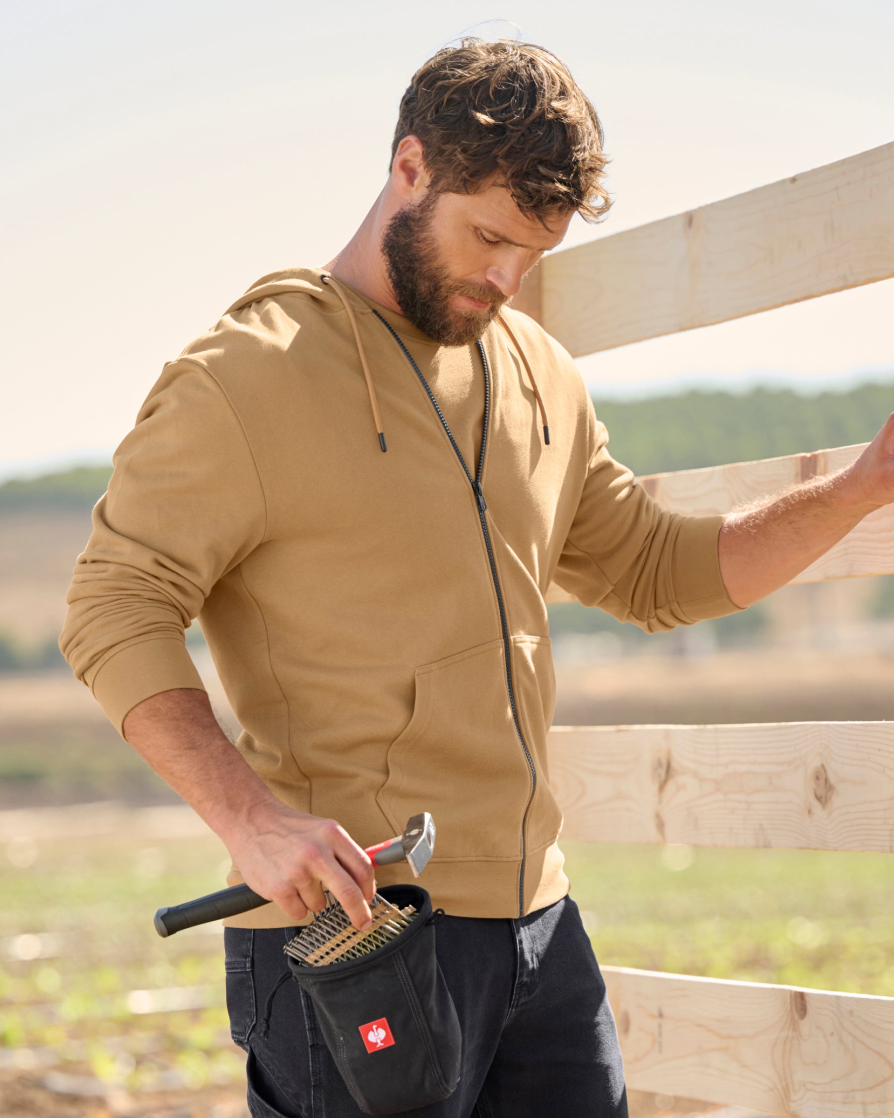 STRAUSS e.s.iconic full-zip hoodie in almond brown, worn in lifestyle setting