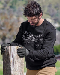 STRAUSS e.s.e:pic artwork crew neck sweatshirt in black, worn in lifestyle setting