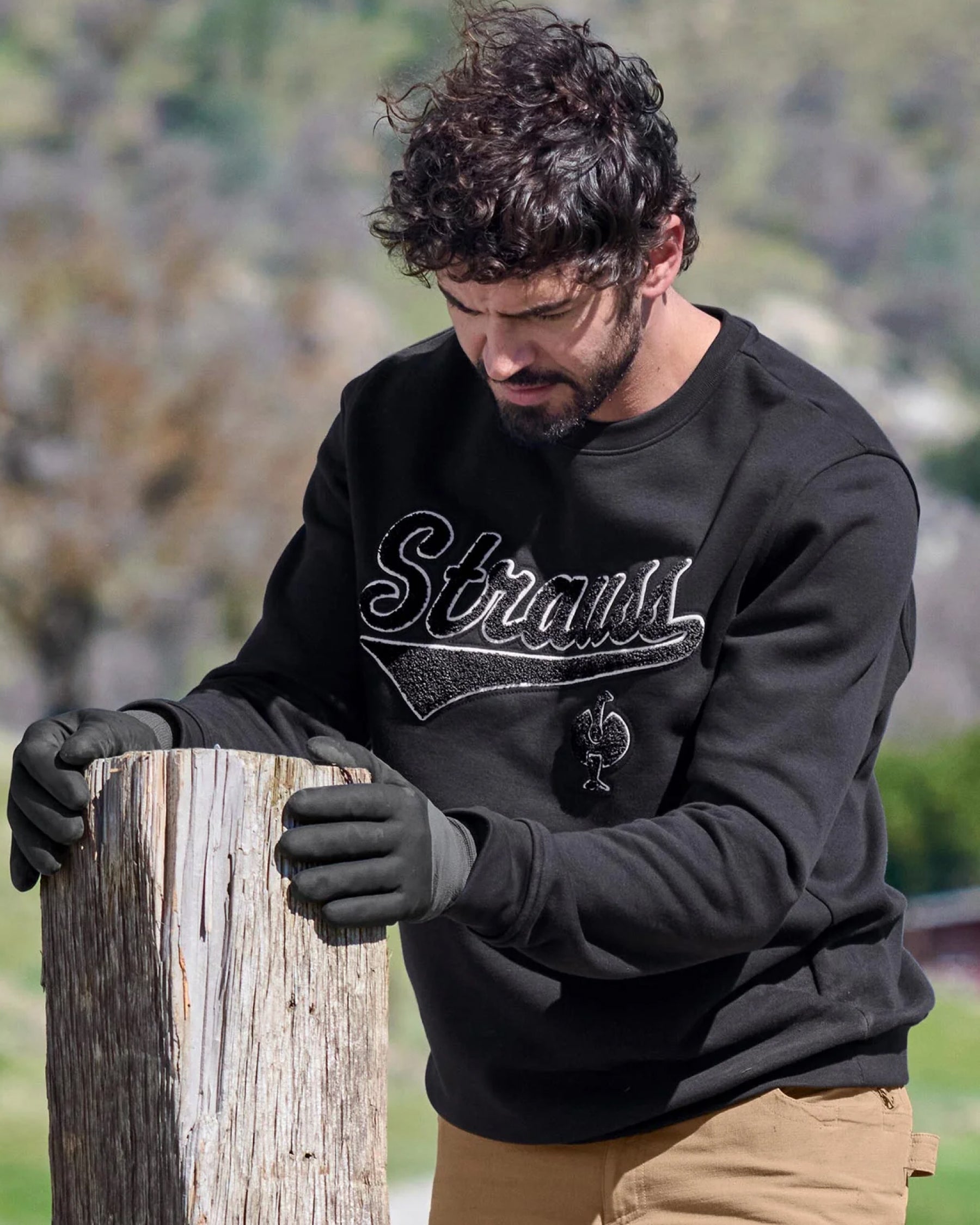 STRAUSS e.s.e:pic artwork crew neck sweatshirt in black, worn in lifestyle setting