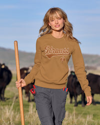Women's STRAUSS e.s.e:pic artwork crew neck sweatshirt in almond brown, worn in lifestyle setting