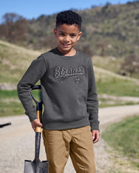 Kids' STRAUSS e.s.e:pic artwork crew neck sweatshirt in carbon gray, worn in lifestyle setting
