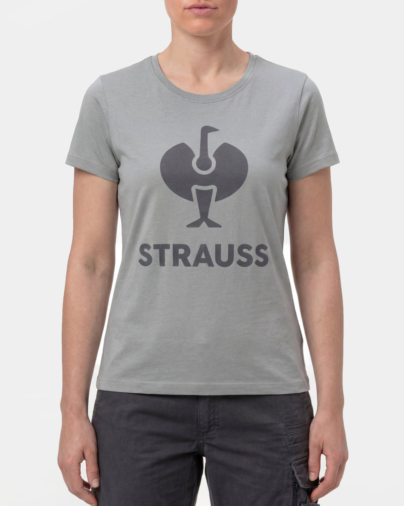 A woman wears the Women's STRAUSS T-Shirt e.s.concrete in pearl gray with work pants and work boots in a studio product scene