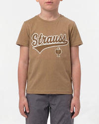 A child wears the Kids' STRAUSS Artwork T-Shirt e.s.e:pic in almond brown with casual workwear pants in a studio product scene