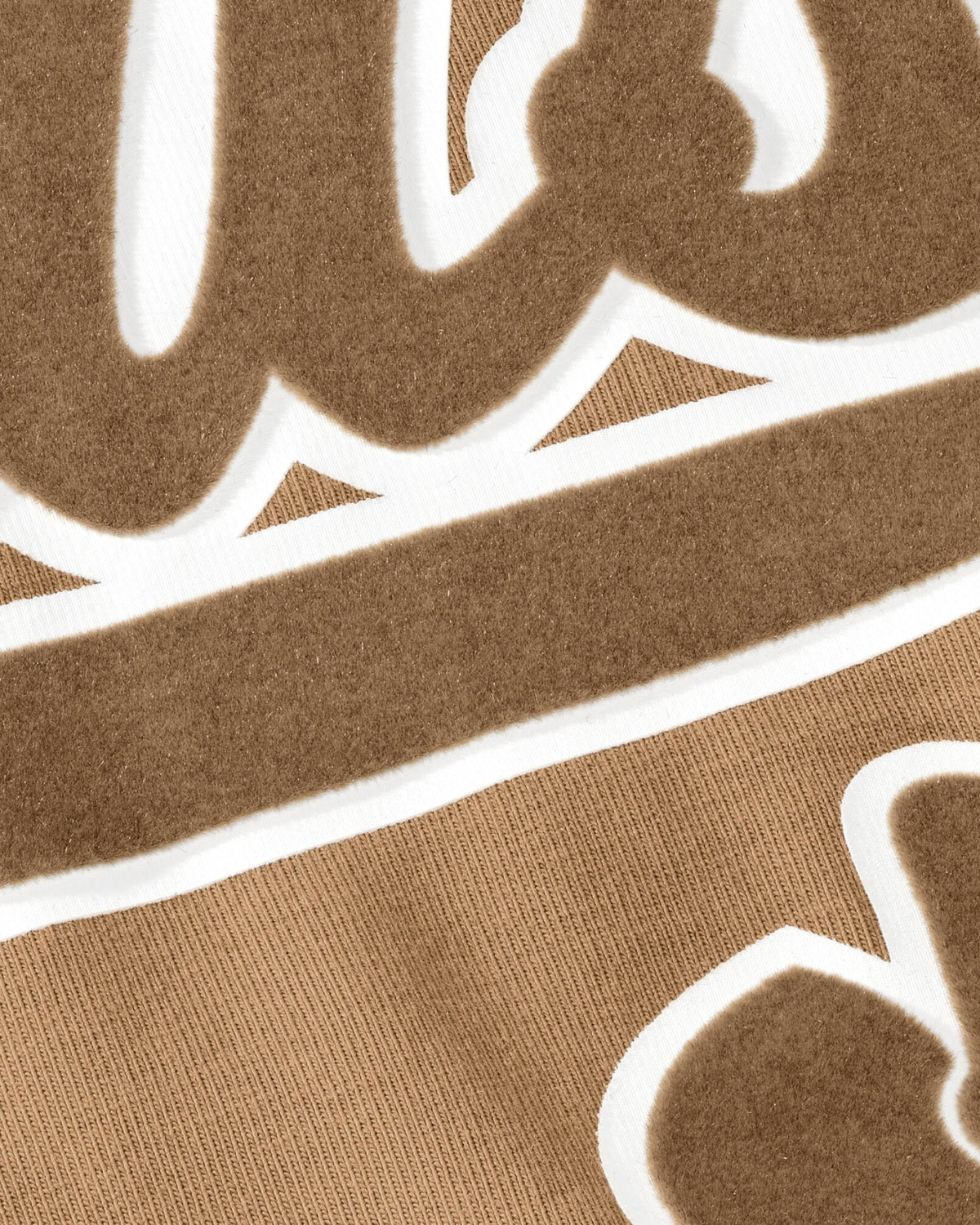 Close-up of the STRAUSS artwork print on the almond brown Kids' STRAUSS Artwork T-Shirt e.s.e:pic