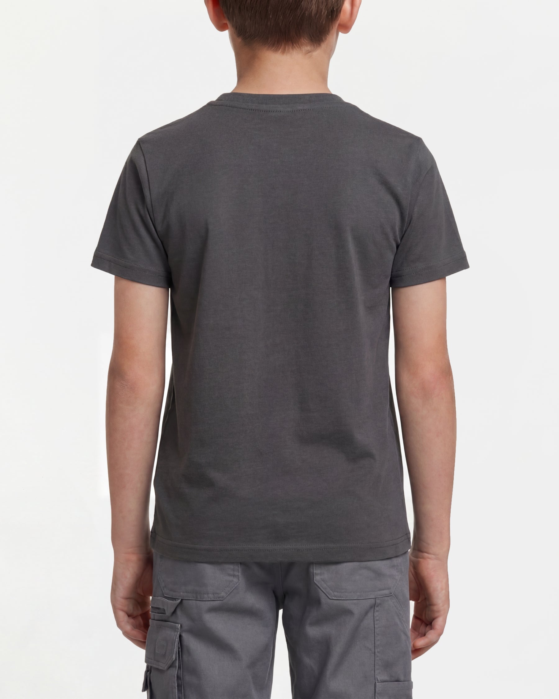 A child wears the Kids' STRAUSS Artwork T-Shirt e.s.e:pic in carbon gray with casual workwear pants, showing the shirt fit