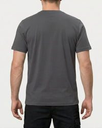 A model wears the STRAUSS Cotton Stretch T-Shirt in carbon gray, showing the shirt fit