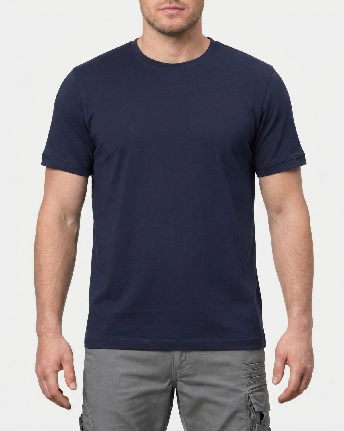 A model wears the STRAUSS Cotton Stretch T-Shirt in nero blue in a studio product scene