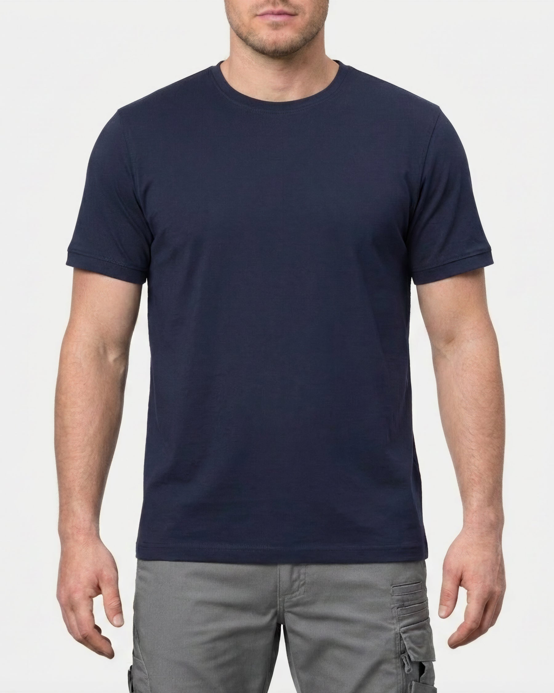A model wears the STRAUSS Cotton Stretch T-Shirt in nero blue in a studio product scene