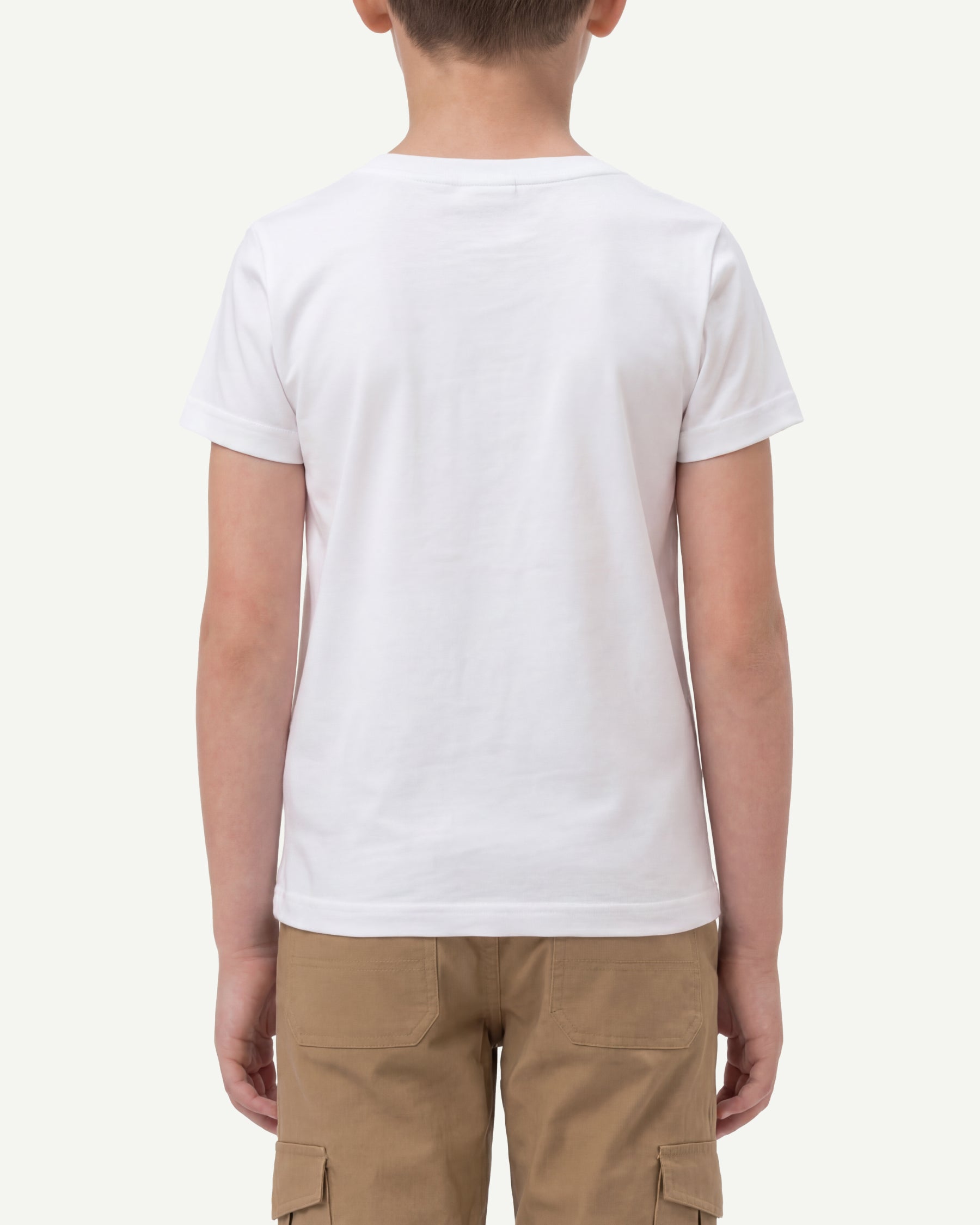 A child wears the Kids' STRAUSS Cotton Stretch T-Shirt in white with kids' work pants, showing the shirt fit
