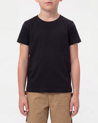 A child model wears the Kids' STRAUSS Cotton Stretch T-Shirt in black with kids' work pants and work boots in a studio product scene