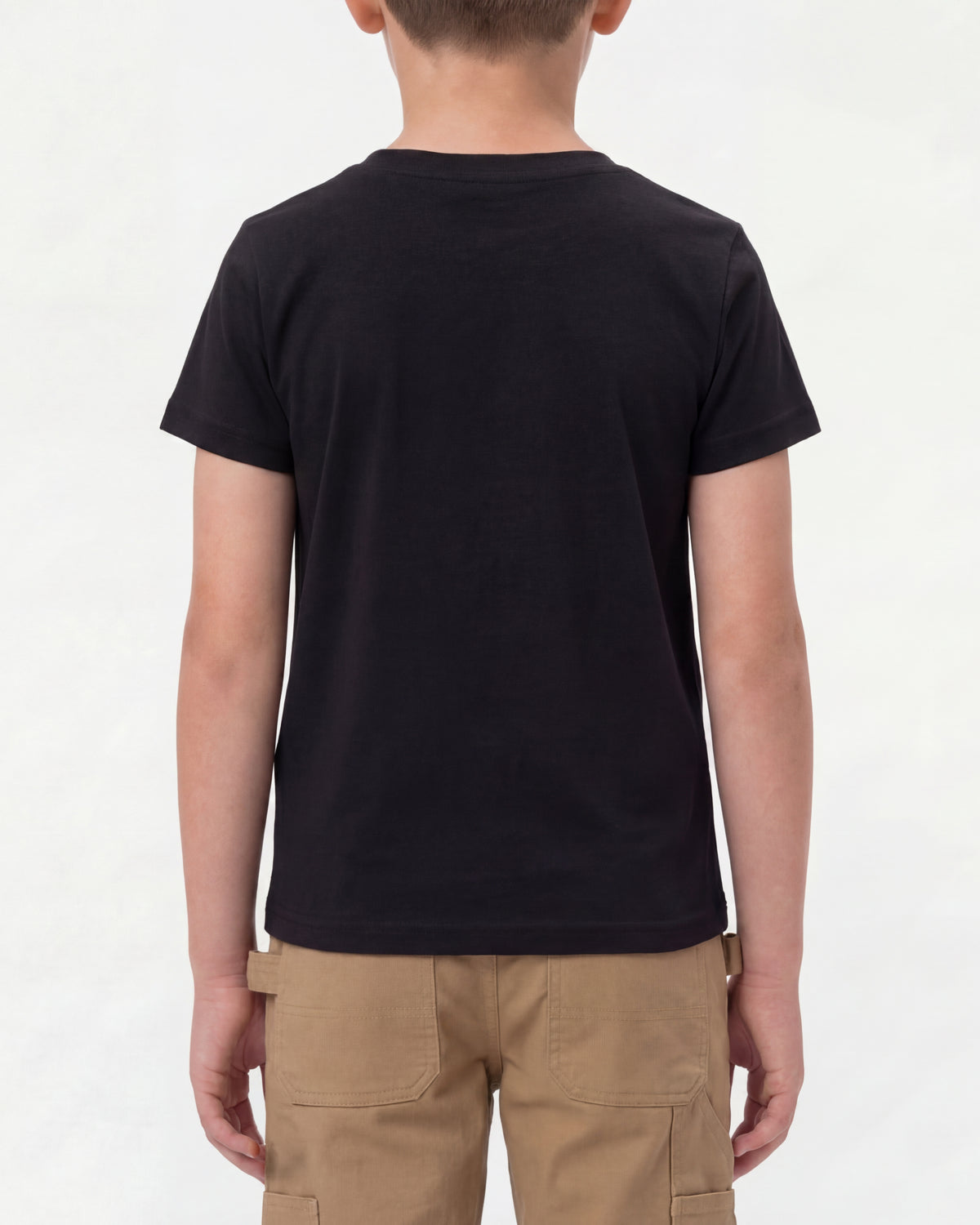 A child wears the Kids' STRAUSS Cotton Stretch T-Shirt in black with kids' work pants and work boots, showing the shirt fit