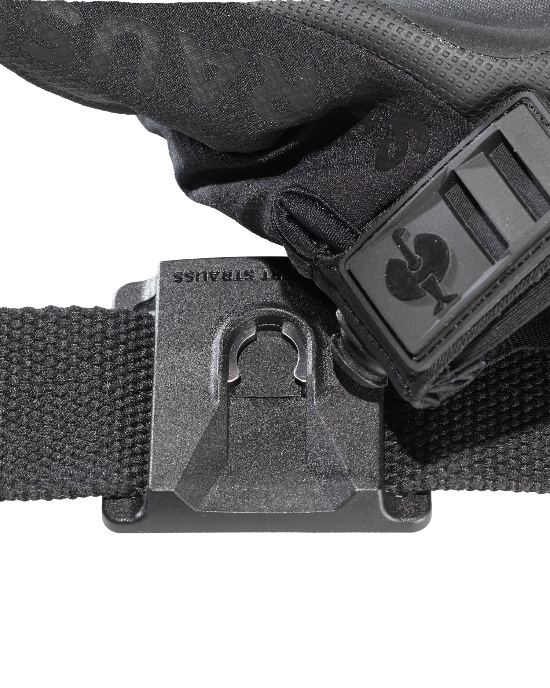Close-up of the black STRAUSS e.s.tool concept glove holder clip holding work gloves on a belt.