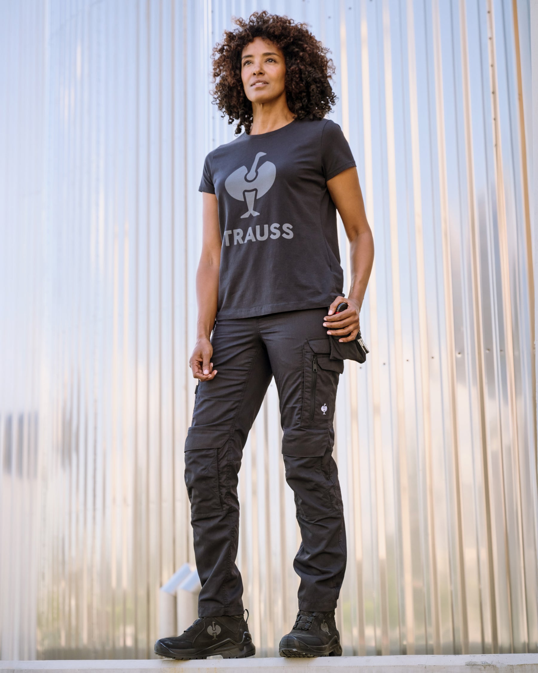Women's Work Pants e.s.concrete light in black in use, showing fit and movement