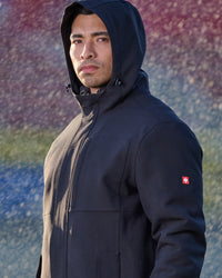 STRAUSS e.s.e:pic waterproof rain coat in black shown during outdoor work
