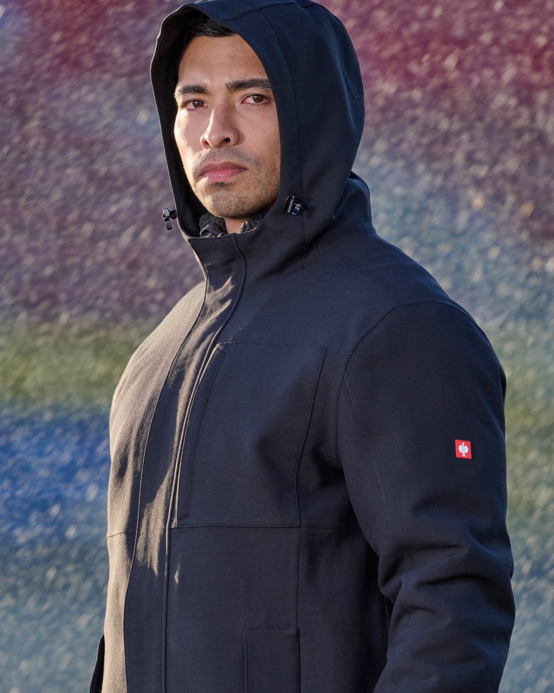 STRAUSS e.s.e:pic waterproof rain coat in black shown during outdoor work