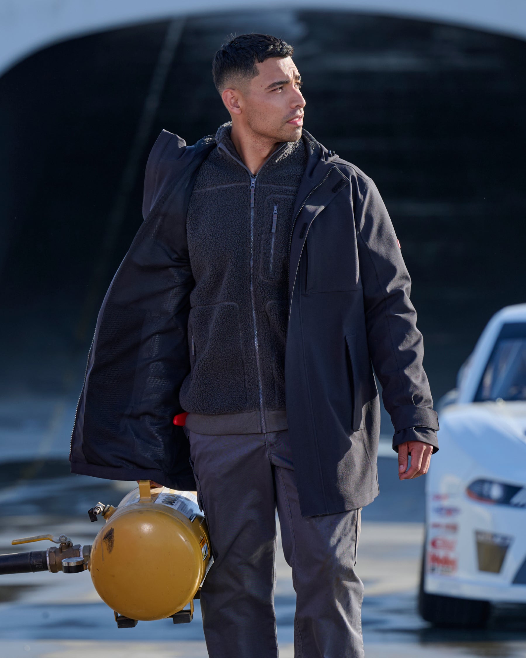 STRAUSS e.s.e:pic waterproof rain coat in black paired with workwear