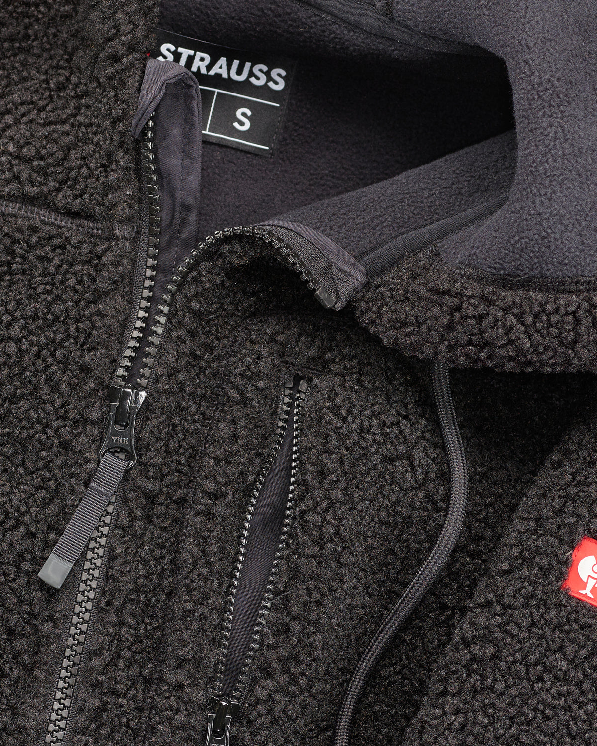 Close-up of sherpa fleece texture and hood details on STRAUSS e.s.e:pic hooded sherpa fleece jacket in black