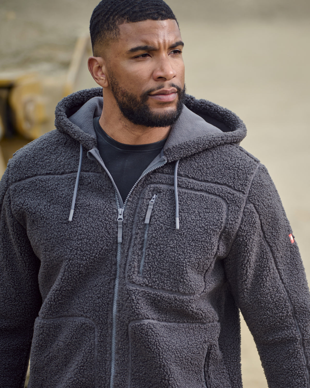 STRAUSS e.s.e:pic hooded sherpa fleece jacket in carbon gray in use on the job