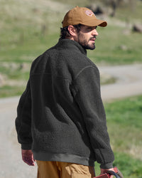 STRAUSS e.s.e:pic sherpa fleece jacket in carbon gray shown during outdoor work