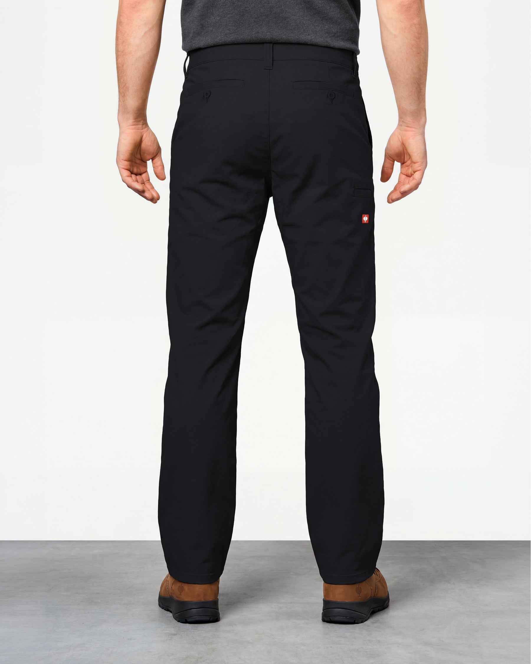 Chino Pants e.s.e:pic in black worn by a model, rear view