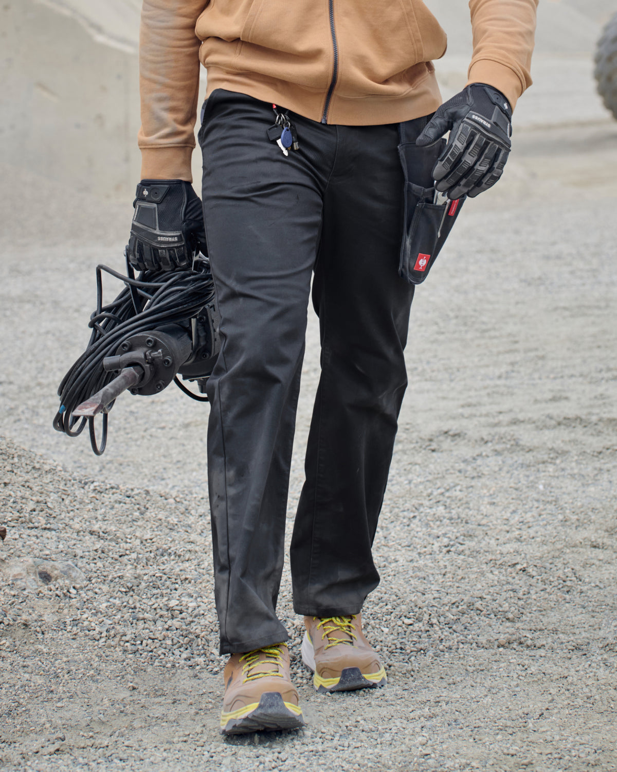 Chino Pants e.s.e:pic in black worn in a work setting