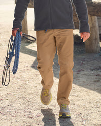 Chino Pants e.s.e:pic in almond brown worn in a work setting