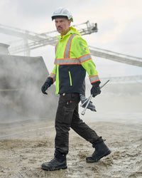 Lifestyle view of Twill Cargo Work Pants e.s.e:pic in black during work