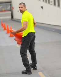 Twill Cargo Work Pants e.s.e:pic in black shown in an outdoor workwear setting