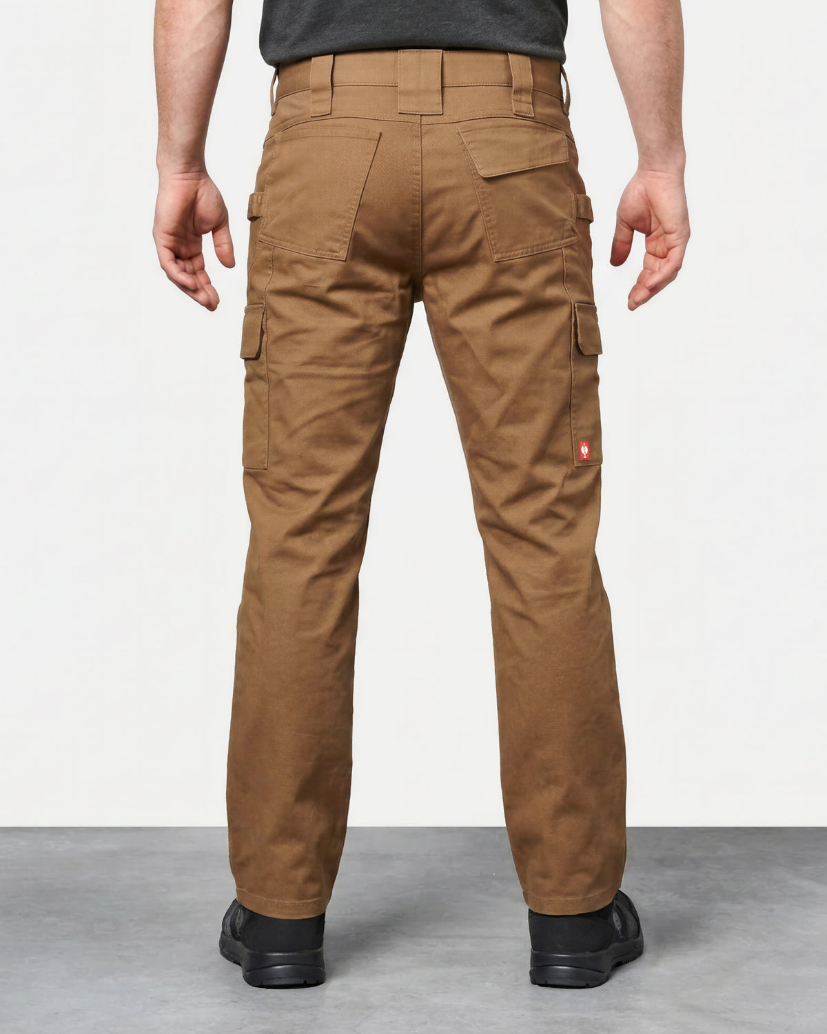 Twill Cargo Work Pants e.s.e:pic in almond brown worn by a model, rear view