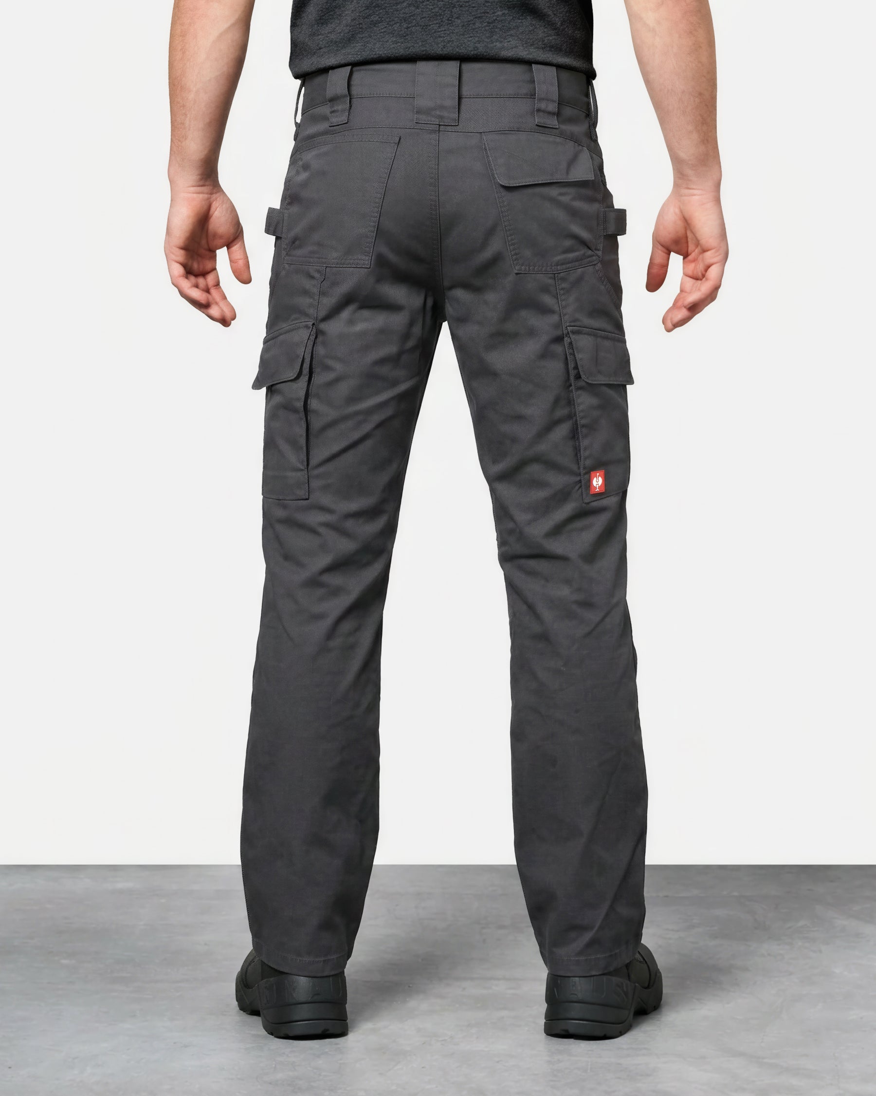 Double Front Twill Cargo Work Pants e.s.e:pic in carbon gray worn by a model, rear view
