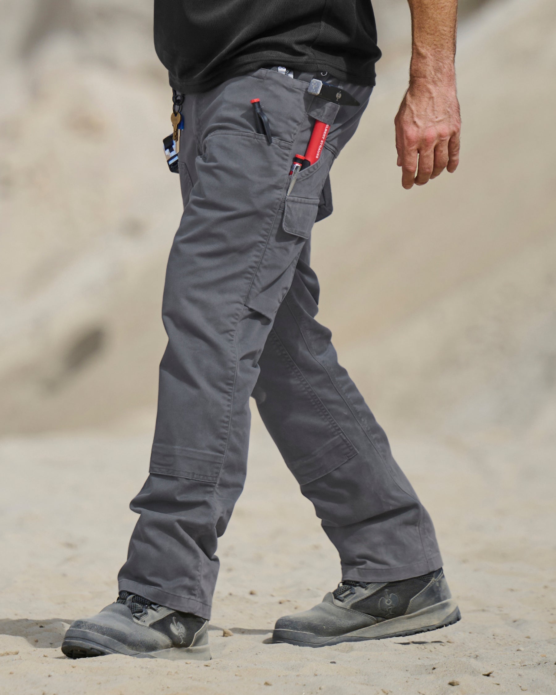 Double Front Twill Cargo Work Pants e.s.e:pic in carbon gray worn in a work setting