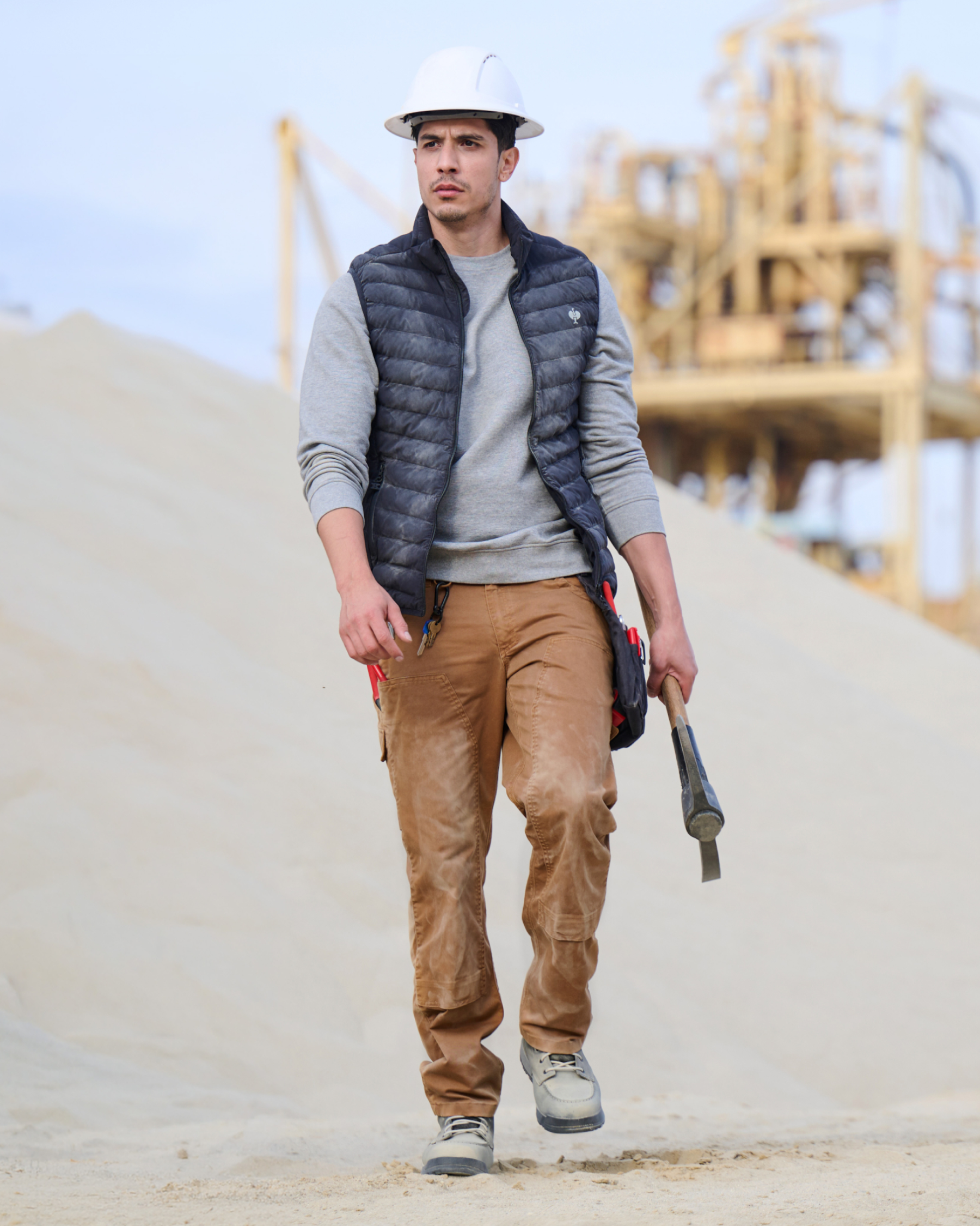 Lifestyle view of Double Front Twill Cargo Work Pants e.s.e:pic in almond brown during work