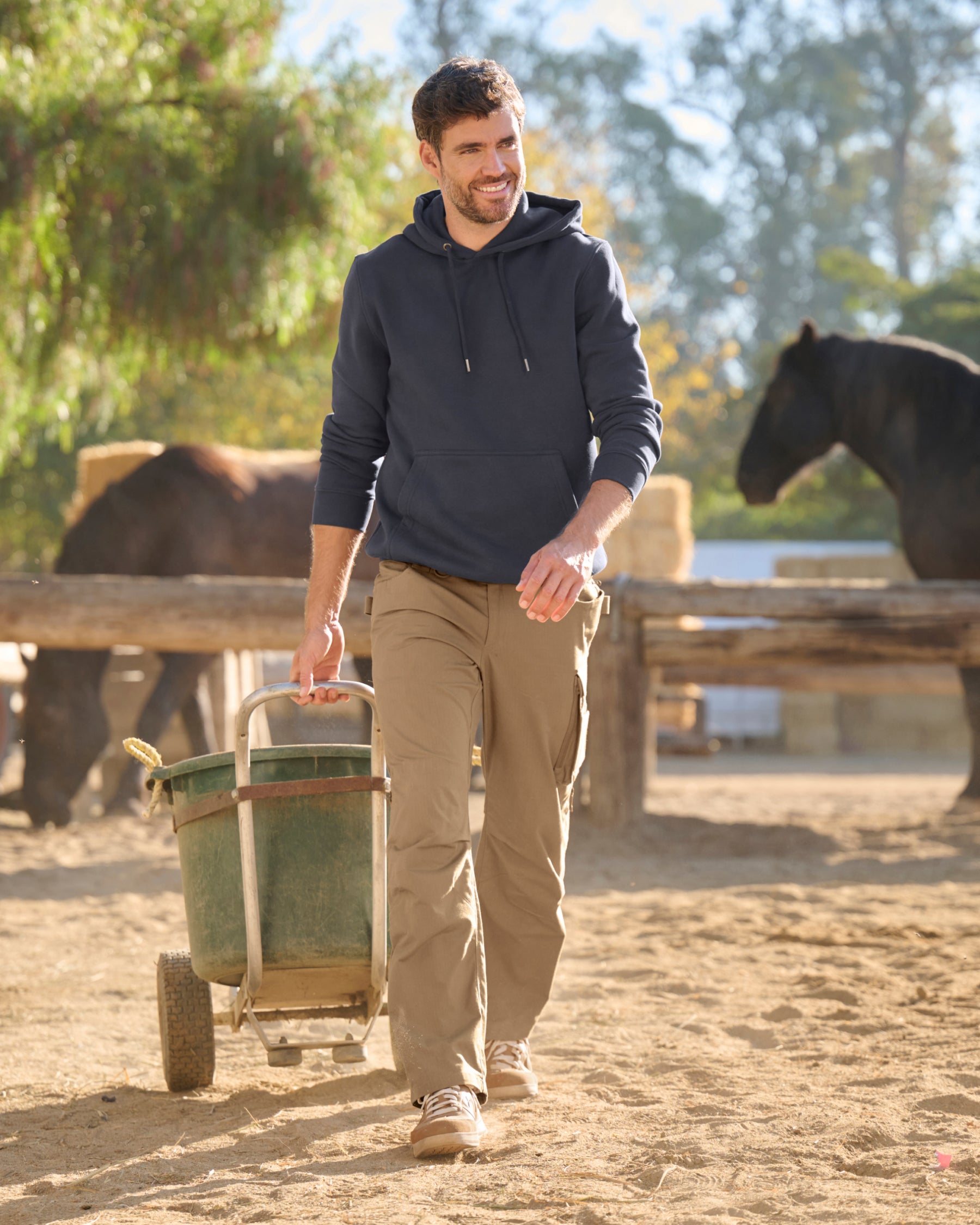 Lifestyle view of Ripstop Cargo Work Pants e.s.e:pic in almond brown during work