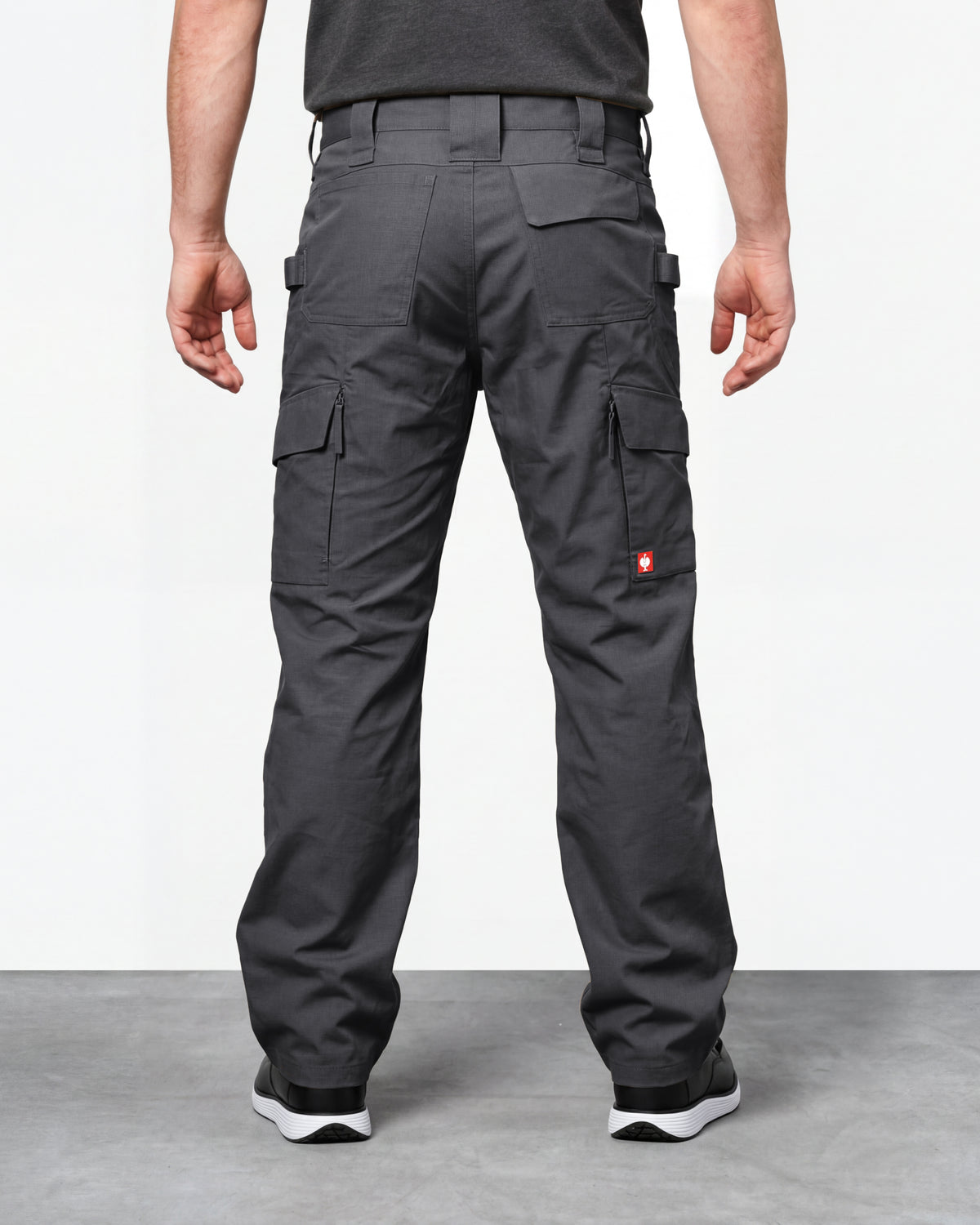 Double Front Ripstop Cargo Work Pants e.s.e:pic in carbon gray worn by a model, rear view