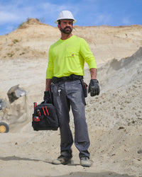 Lifestyle view of Double Front Ripstop Cargo Work Pants e.s.e:pic in carbon gray during work